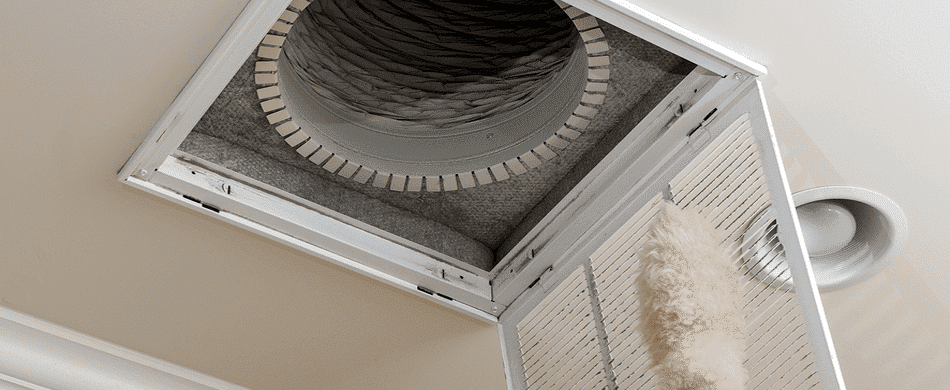 A ceiling air vent with the cover open and disconnected ductwork visible inside.