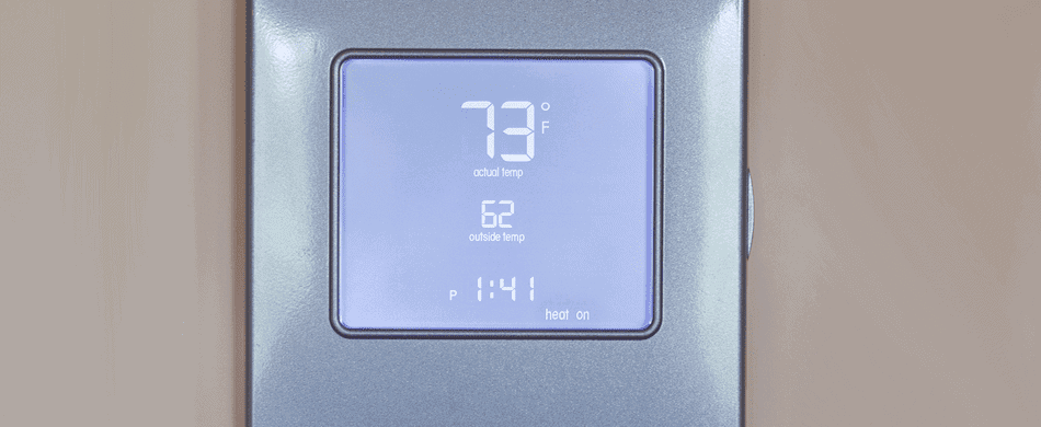 Digital thermostat showing an indoor temperature of 73°F, outdoor temperature of 62°F, and a set time of 1:41.